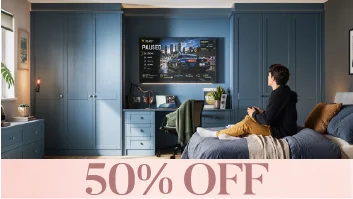 Man gaming in stylish blue bedroom with 50% off banner