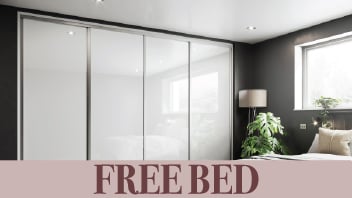 Modern bedroom with white sliding wardrobe and window