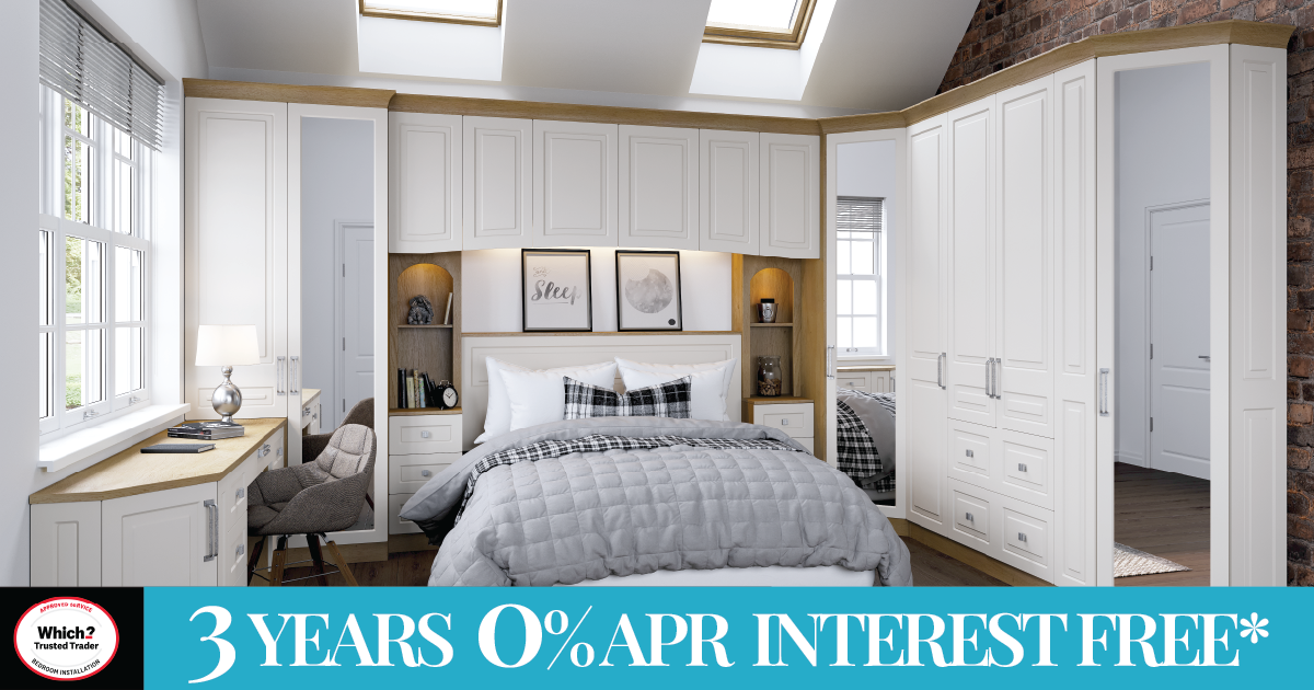 Modern bedroom with fitted white wardrobes