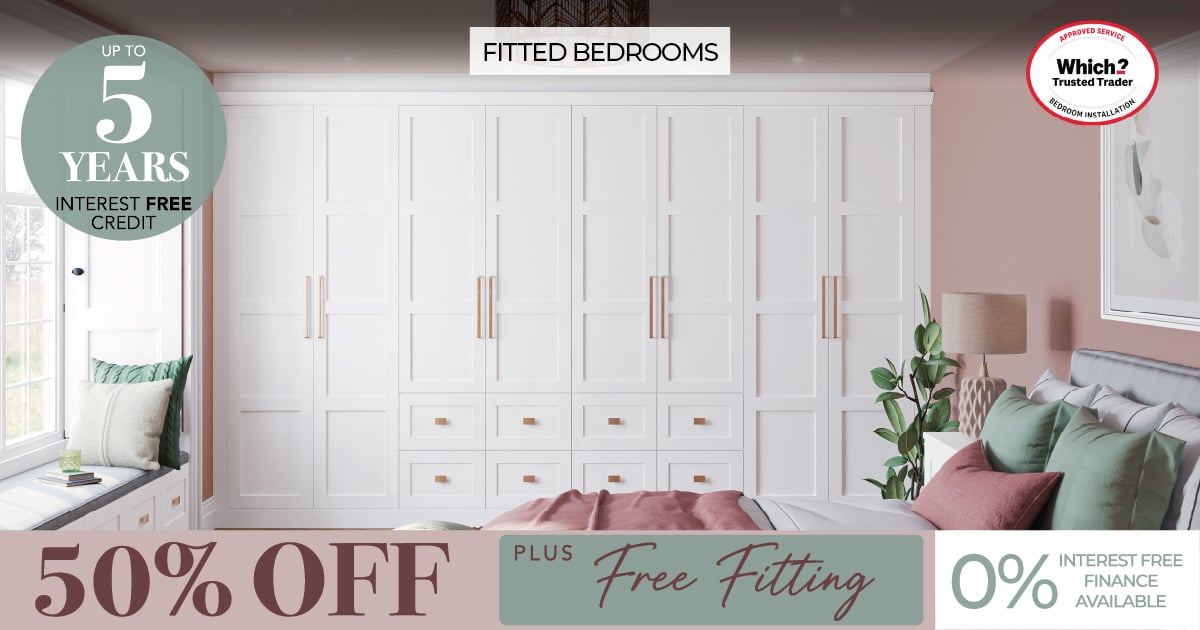 White fitted wardrobes in modern pink bedroom